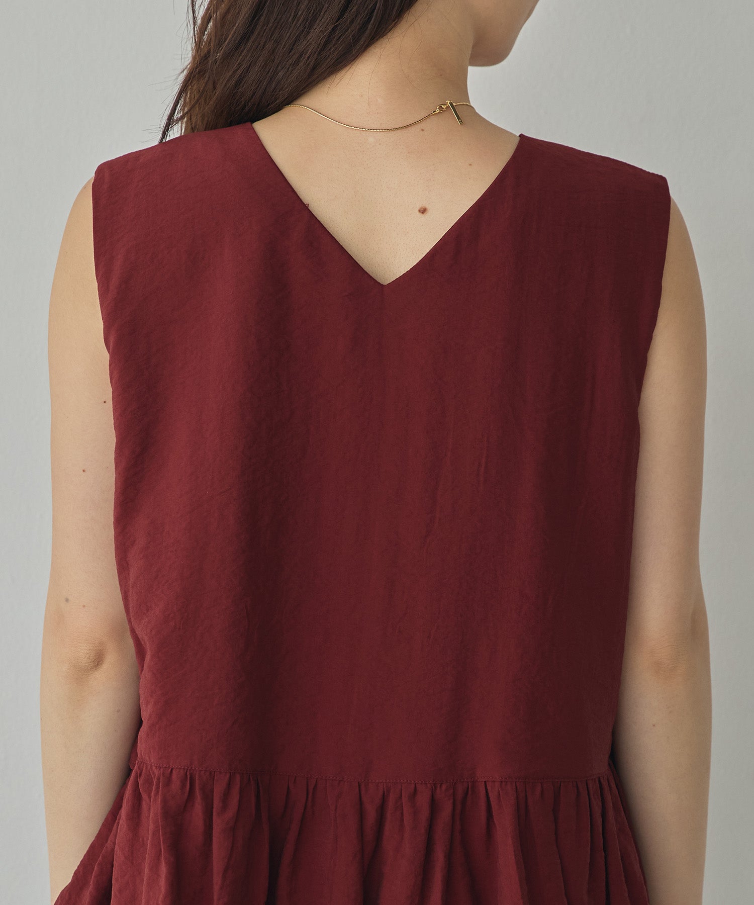 SLEEVELESS RUFFLED TOPS