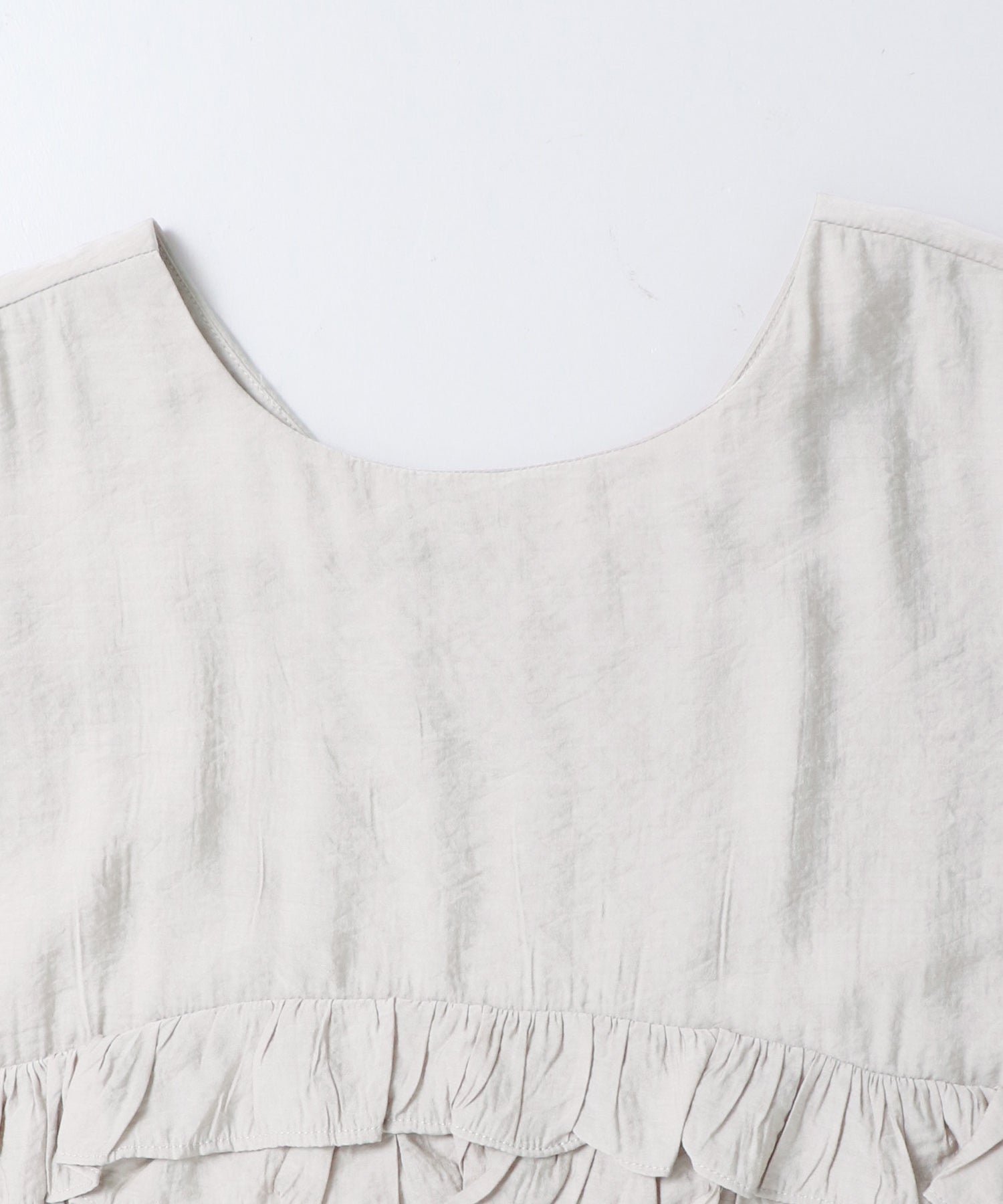 SLEEVELESS RUFFLED TOPS