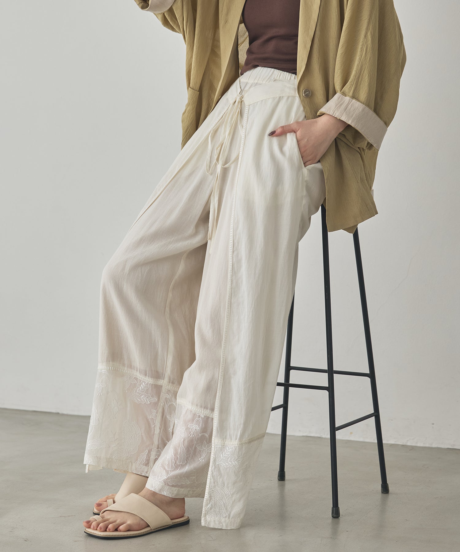 HEM-EMBROIDERED WRAP PANTS