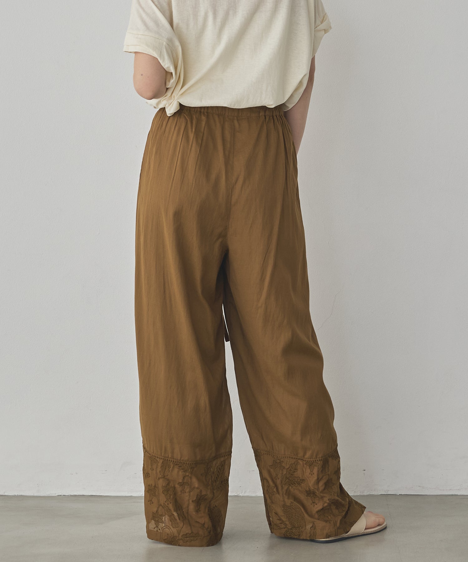 HEM-EMBROIDERED WRAP PANTS