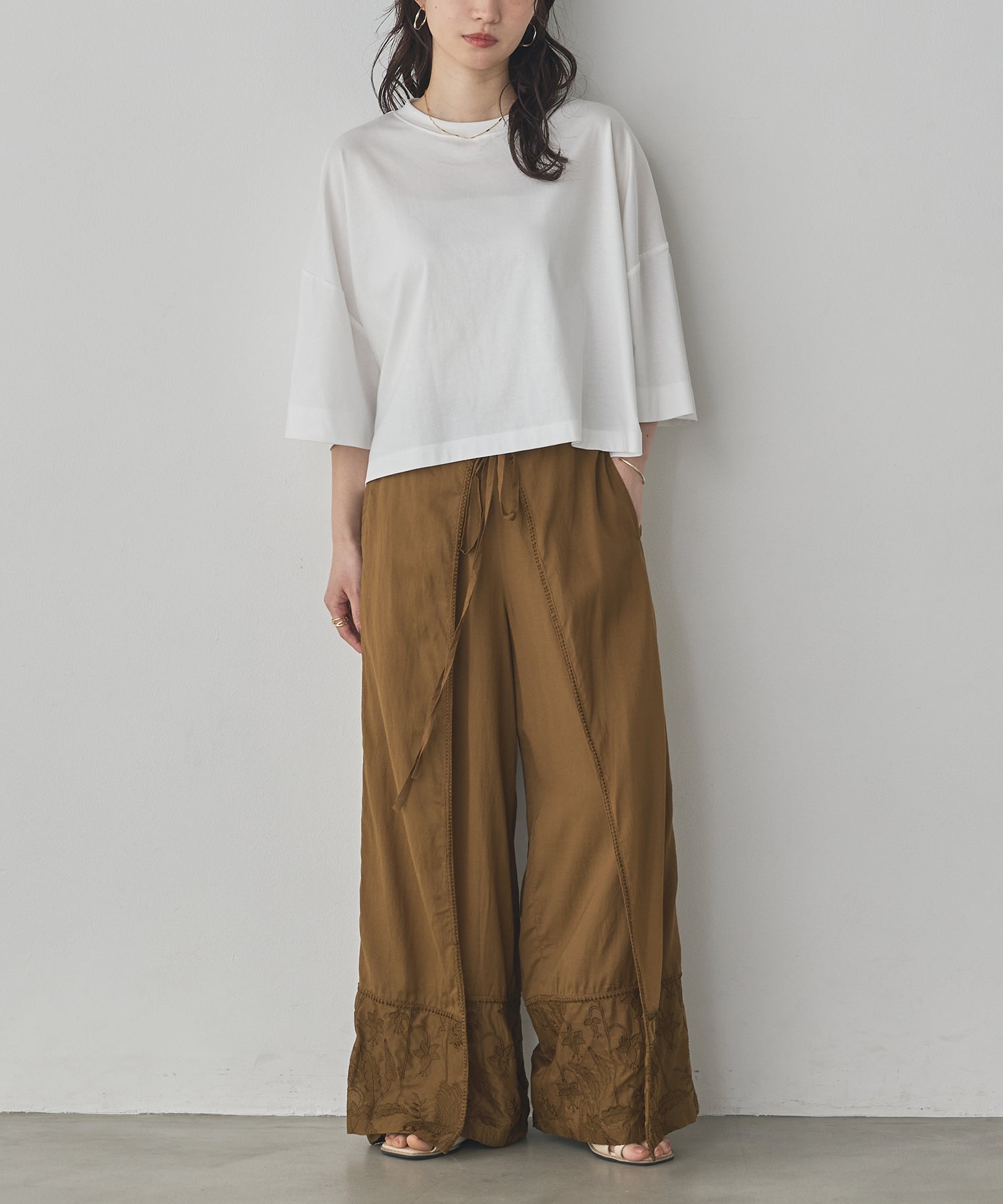 HEM-EMBROIDERED WRAP PANTS
