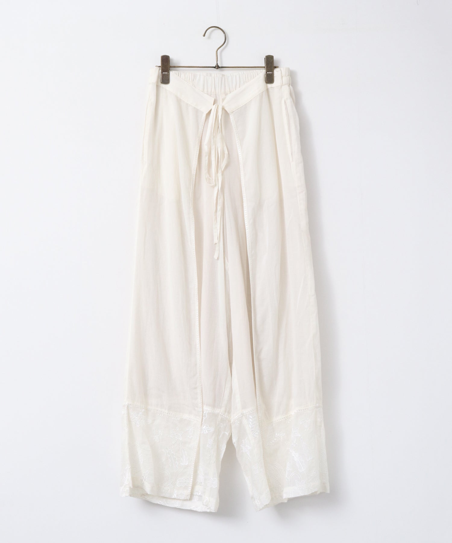 HEM-EMBROIDERED WRAP PANTS