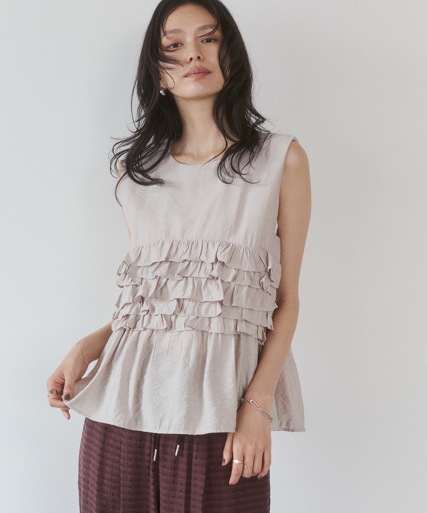 SLEEVELESS RUFFLED TOPS
